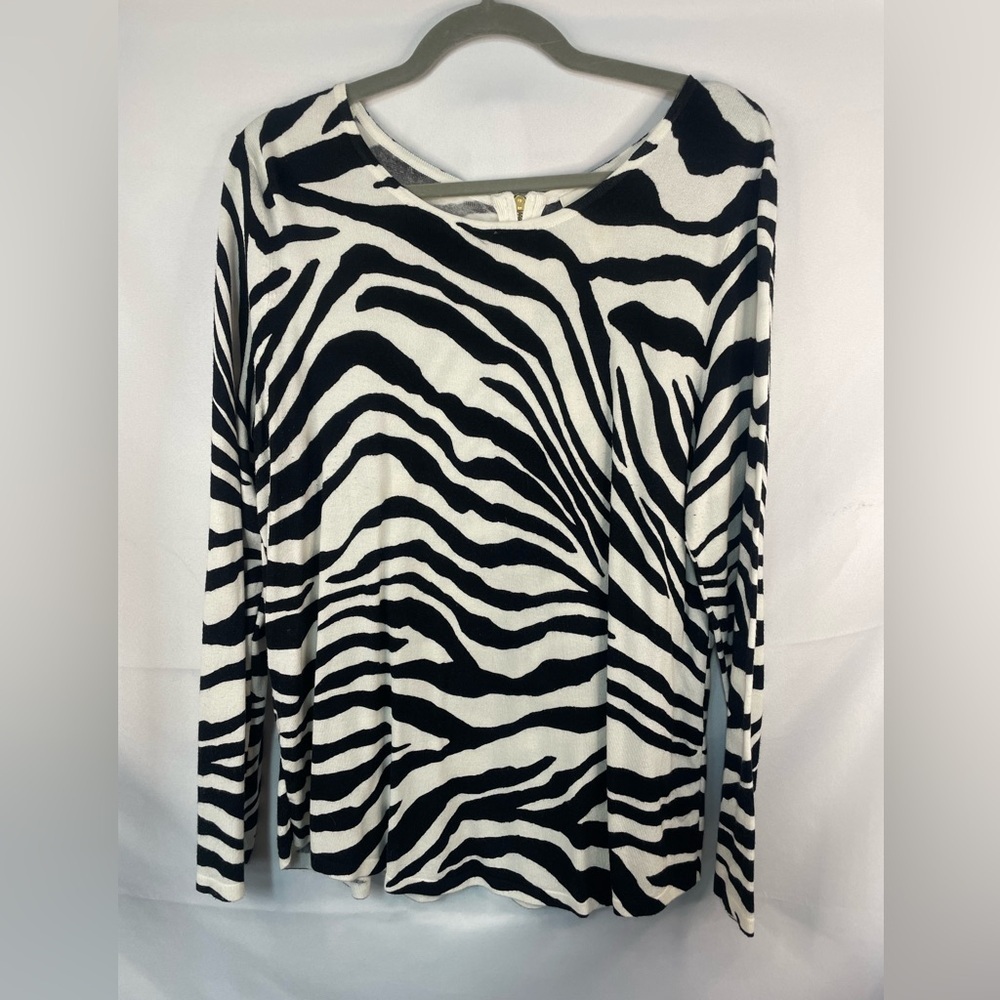 Chicos black and white zebra print sweater. Gold accents and it’s sooo soft!